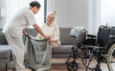 doctor-taking-care-senior-woman-home-2-1